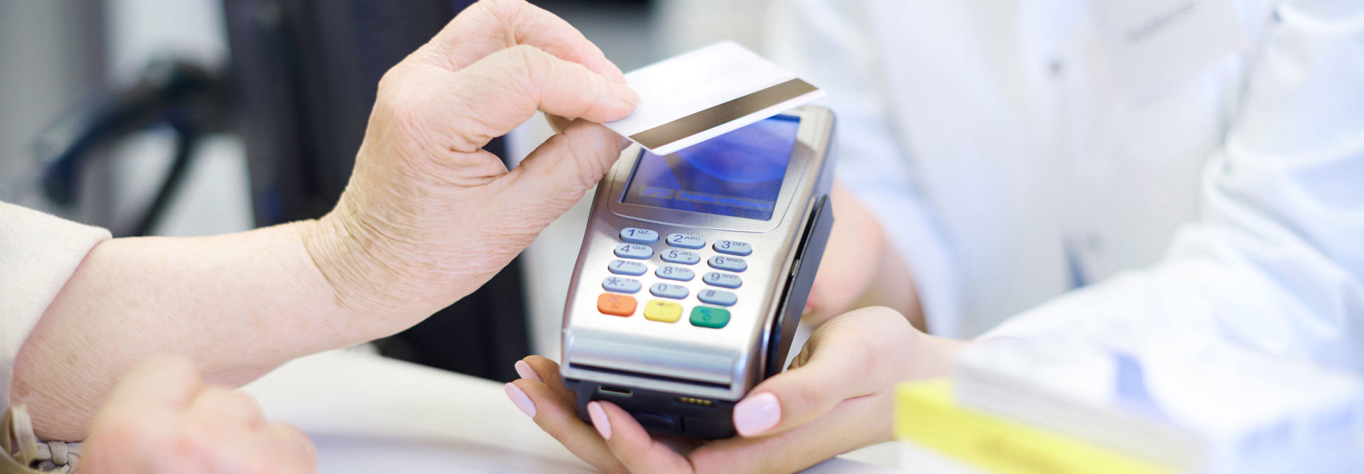 Patient scanning her credit card