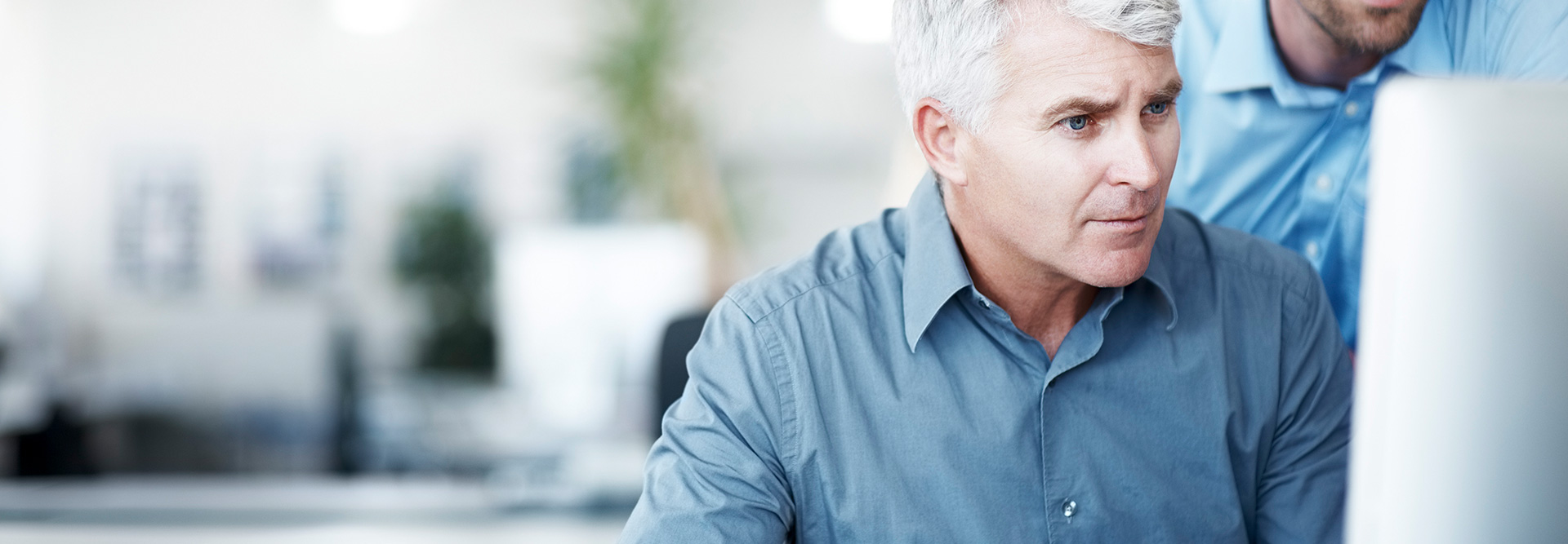 Man looking at a computer
